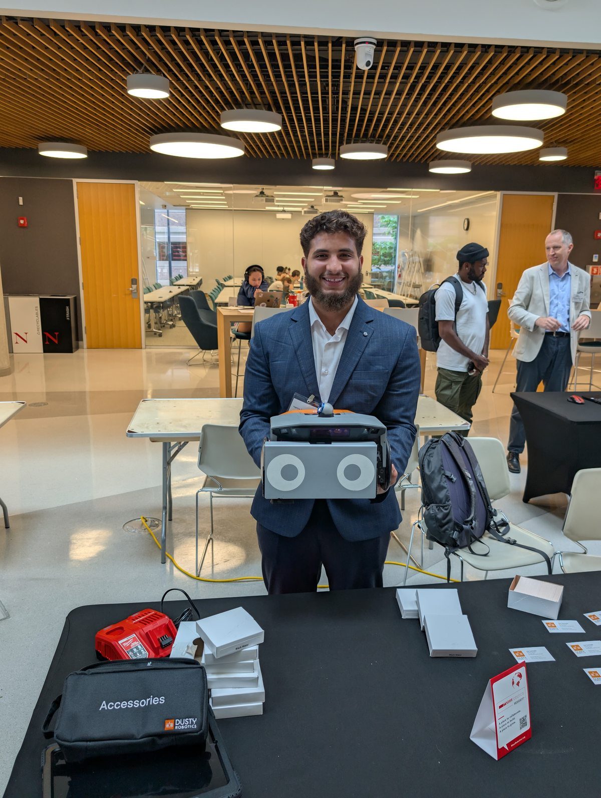 Hamza representing COROSOLS at a US robotics-in-construction event.